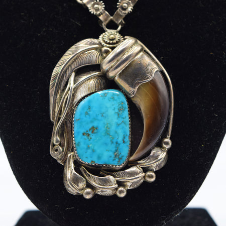 Silver and Turquoise  Bear Claw Necklace with leafs decoration.