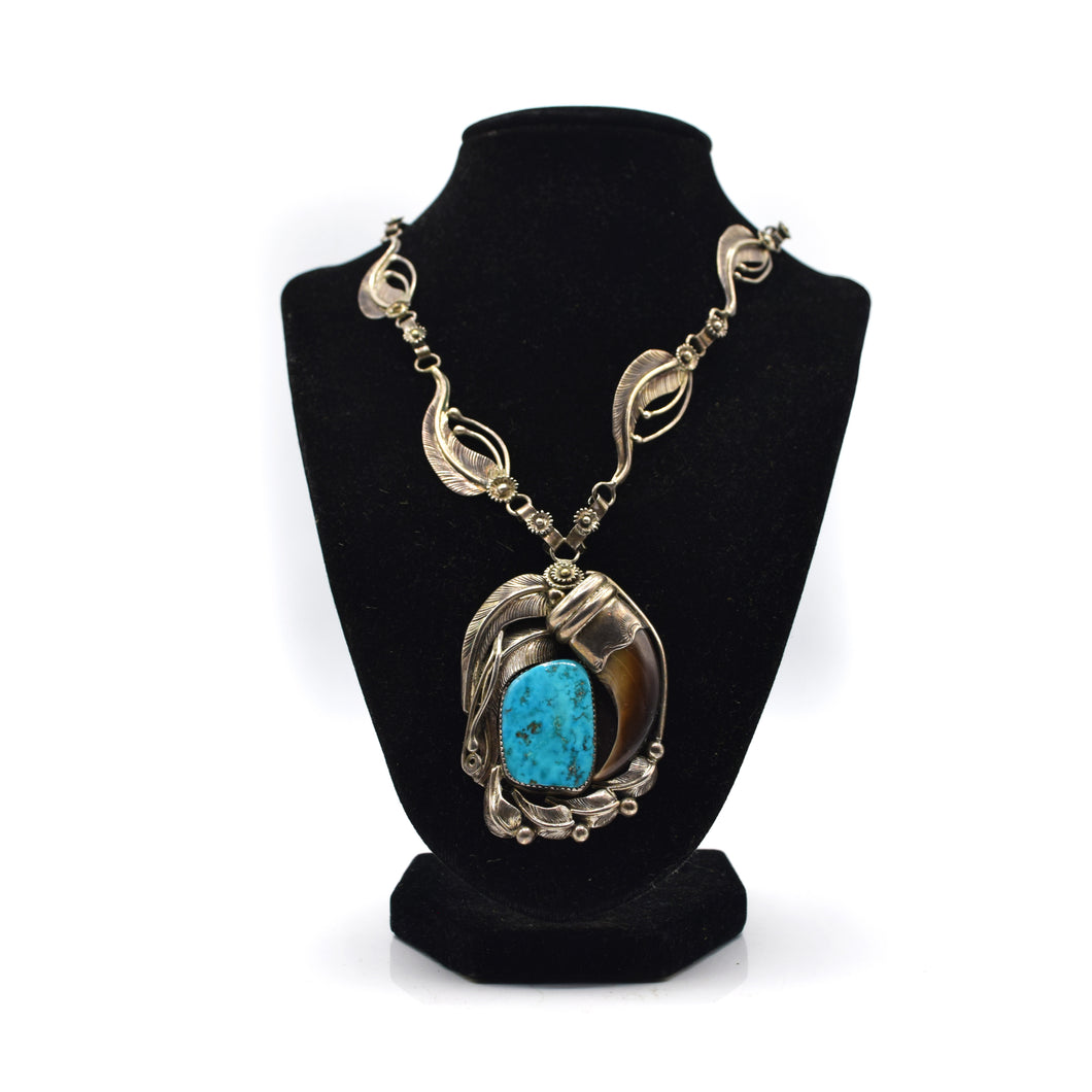 Silver and Turquoise  Bear Claw Necklace with leafs decoration.